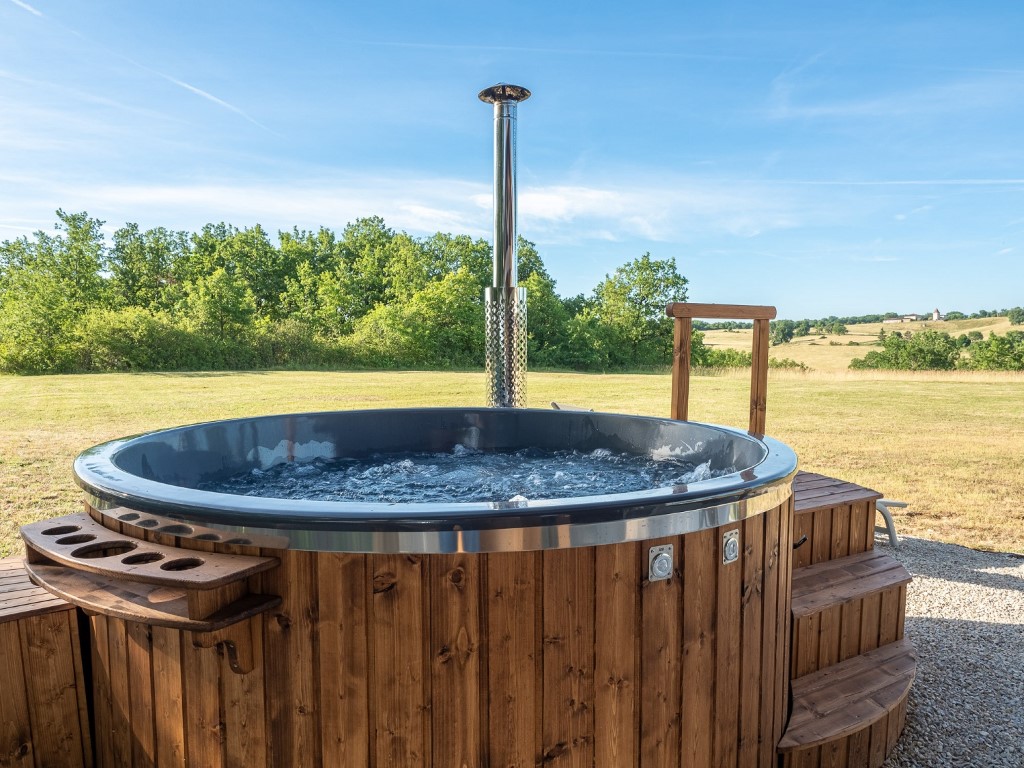 With views over the extensive and exclusive private grounds - our 6 seater wood-fired hot tub